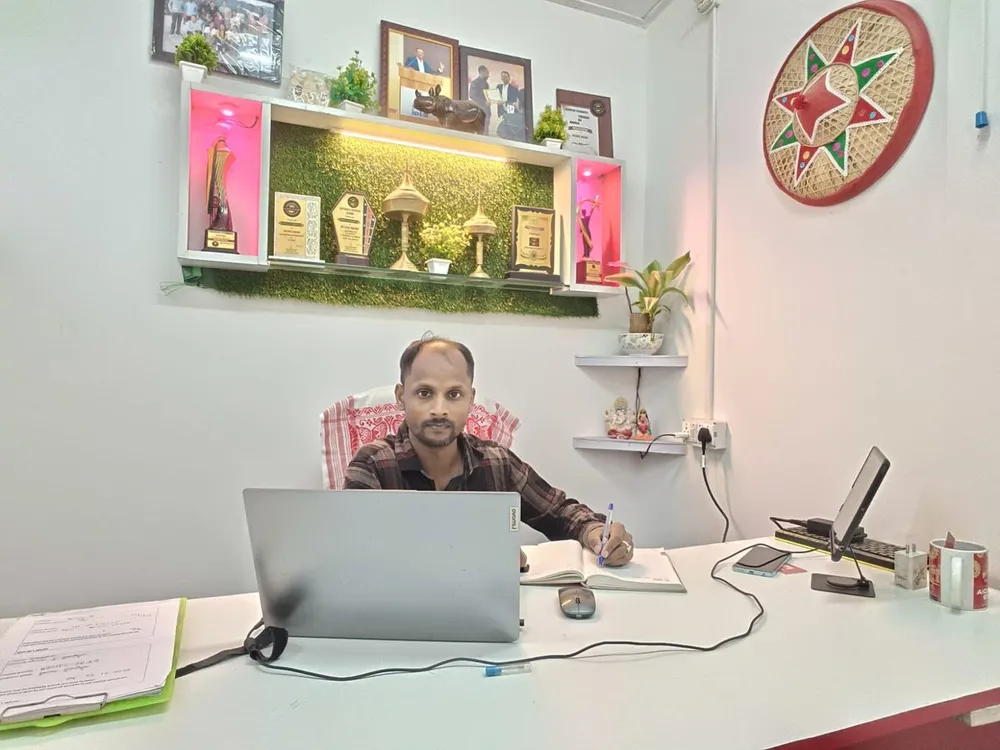 The director at his desk in the Sarathi office